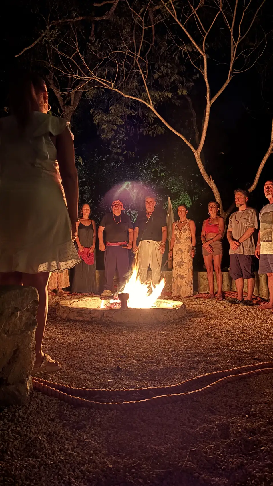 Nighttime circle around the fire at a spiritual retreat in the Maya Jungle of Tulum