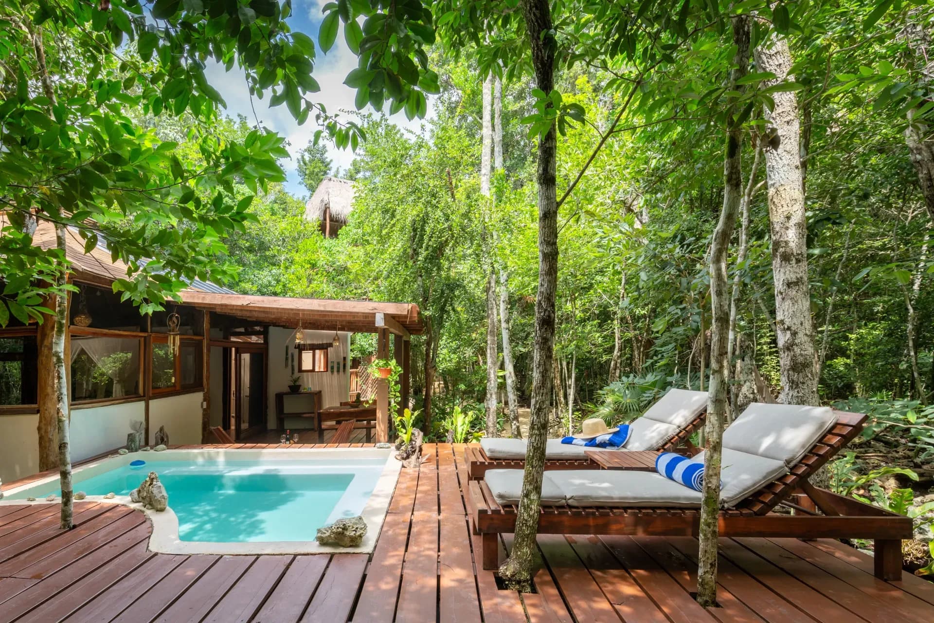 Private villa with a cenote-water pool surrounded by jungle at Pepem, Tulum